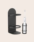 No-drill wall holder for an electric toothbrush and razor, shown mounted in a bathroom