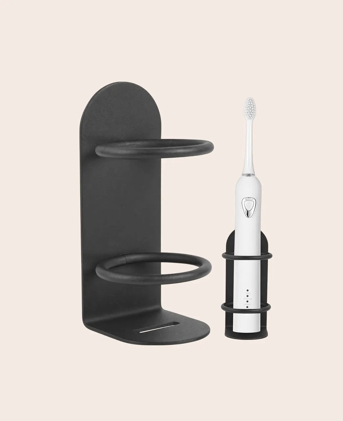 No-drill wall holder for an electric toothbrush and razor, shown mounted in a bathroom