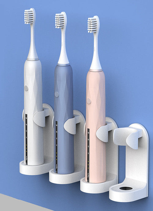 Electric toothbrush placed in a compact bathroom holder