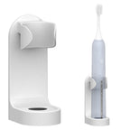 Tidy bathroom counter featuring an electric toothbrush holder