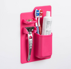 Multi-functional toothbrush holder beside a bathroom basin