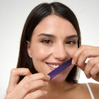 Teeth whitening strip pack displayed against a clean background