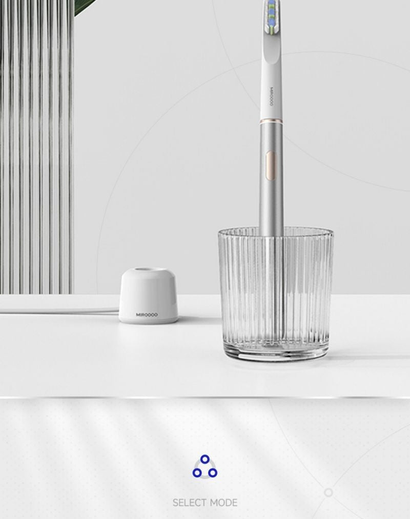 Electric toothbrush viewed from the side to show its streamlined shape