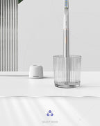 Electric toothbrush viewed from the side to show its streamlined shape