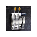 Wall-mounted toothbrush holder with compartments for toothpaste and razors