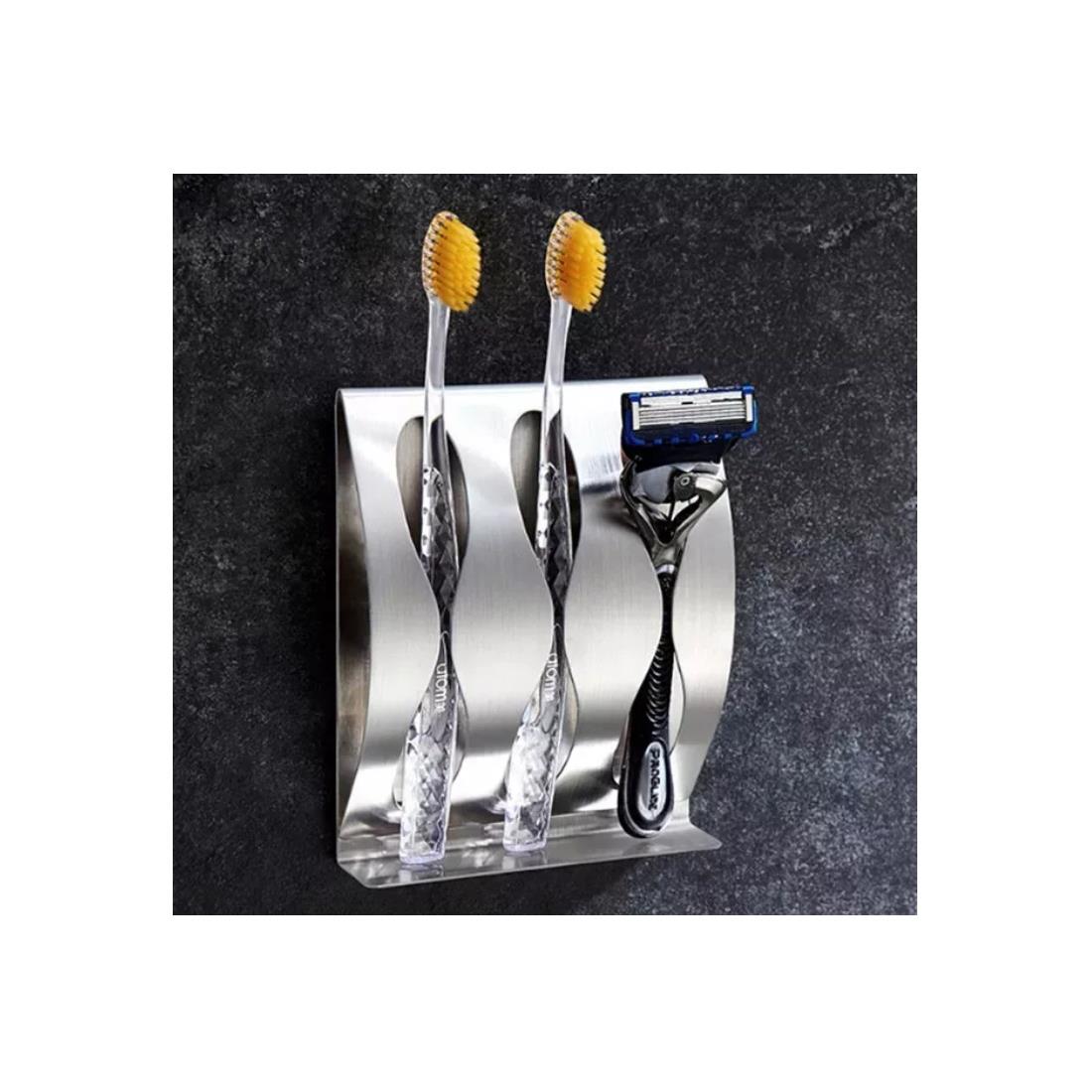 Wall-mounted toothbrush holder with compartments for toothpaste and razors