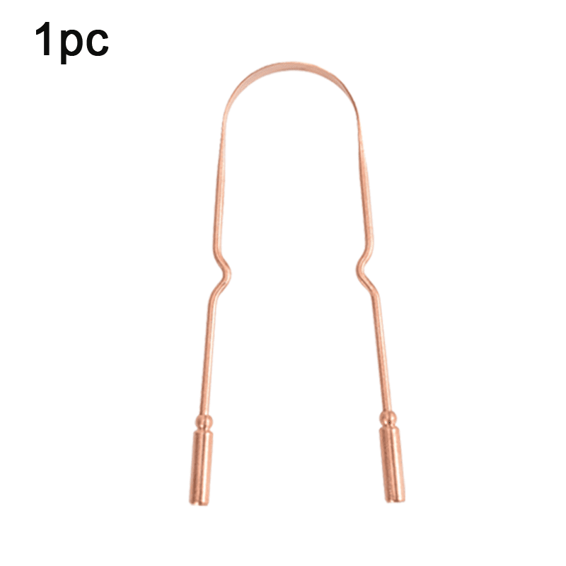 Copper tongue scraper positioned for a daily oral hygiene routine