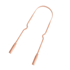 Copper tongue scraper displayed against a clean neutral background