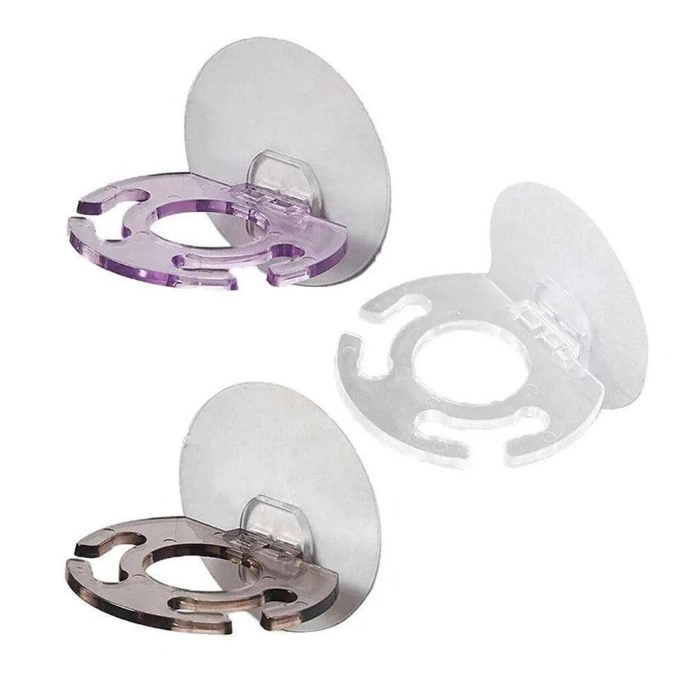 Toothbrush holder fixed to a bathroom wall with suction cups