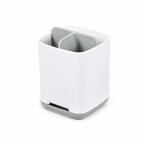 Grey toothbrush holder bathroom organiser beside a sink