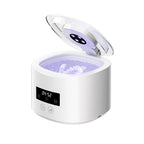 Ultrasonic denture cleaner with UV-C light shown with dentures
