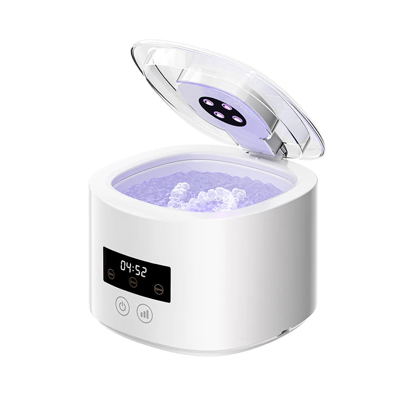 Ultrasonic denture cleaner with UV-C light shown with dentures