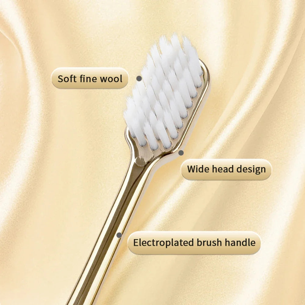 Adult toothbrush with a sleek silver handle and soft bristles