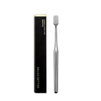Luxury-style soft-bristle toothbrush in a gold finish