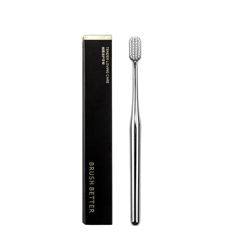 Luxury-style soft-bristle toothbrush in a gold finish