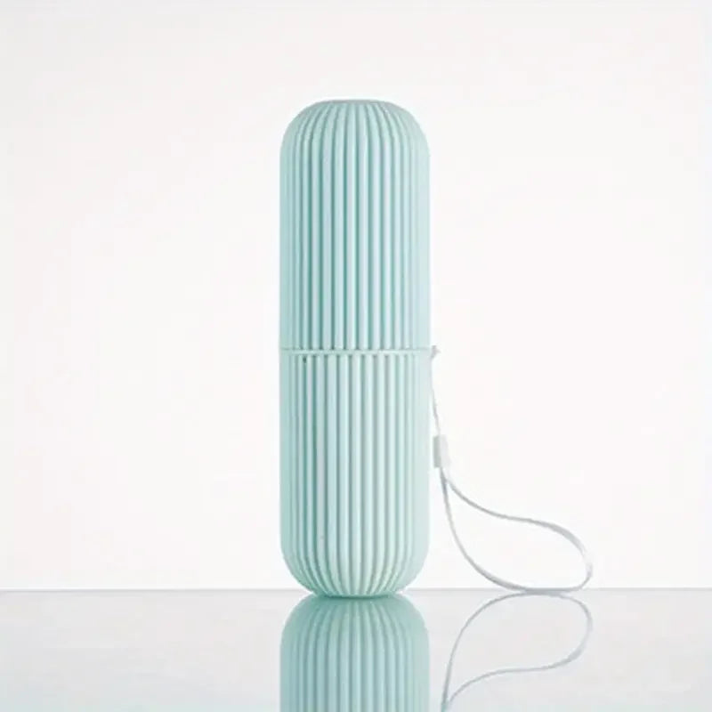 Travel oral care case displayed with a toothbrush and tongue scraper