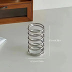 Stainless steel bathroom organiser with toothbrush compartments