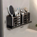 Close-up of the shelf’s toothbrush and razor holder