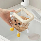 Cartoon toothbrush holder providing tidy storage beside a bathroom sink