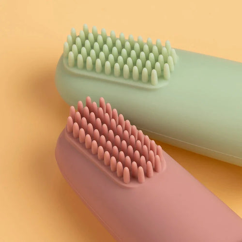 Gentle infant toothbrush displayed against a plain background