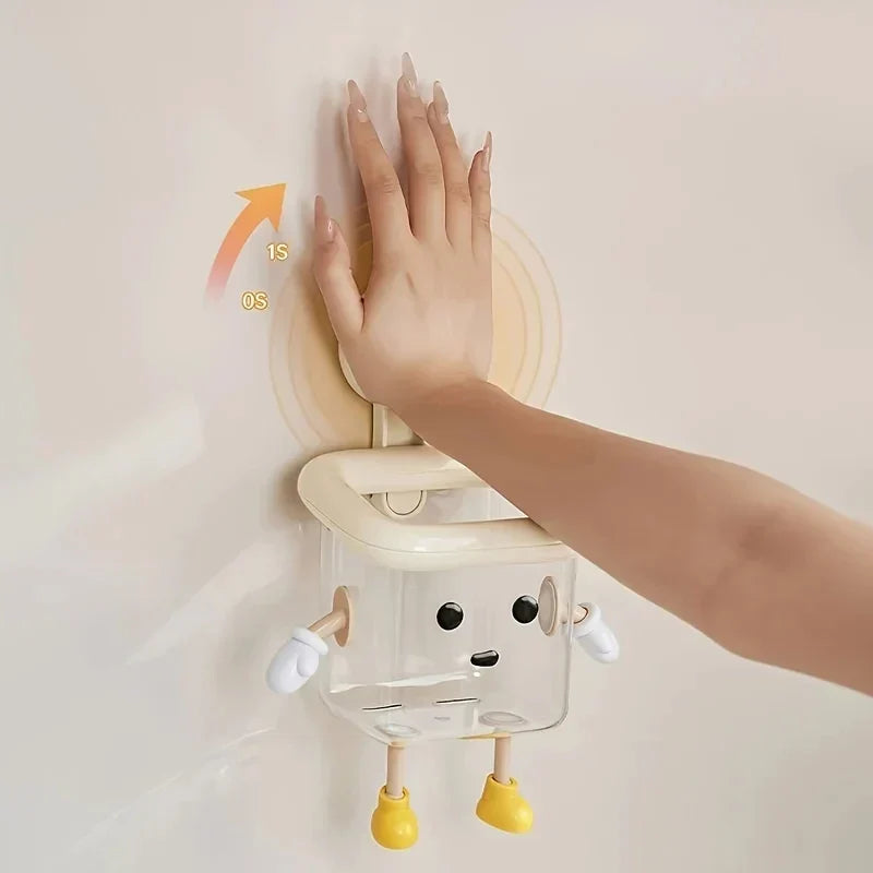 Close-up of a wall-mounted toothbrush holder with a playful cartoon design