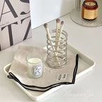 Compact toothbrush holder designed for bathroom countertops
