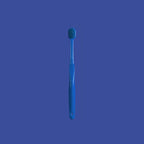 Manual toothbrush for daily adult oral hygiene with a gentle brush