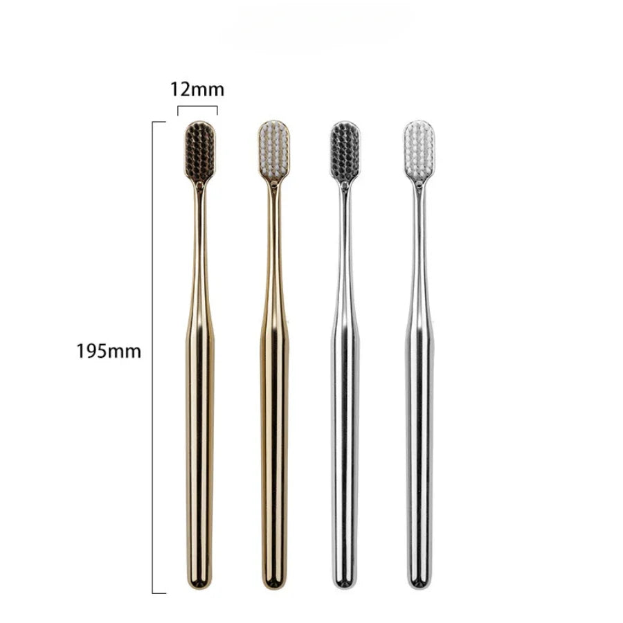 Adult toothbrush with a sleek gold handle and soft bristles