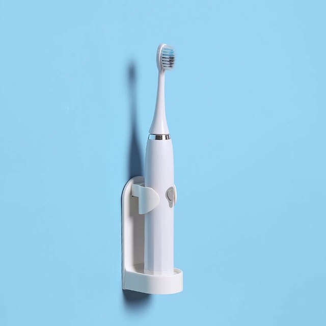 Compact electric toothbrush stand for everyday use