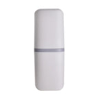 Compact oral care case beside a rinse cup