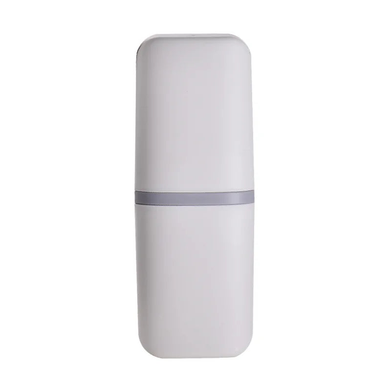 Compact oral care case beside a rinse cup