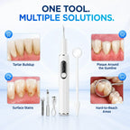 Hand holding the ultrasonic dental cleaner during a home oral care routine