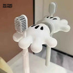 Cartoon hand wall hook shown ready for use on a smooth surface