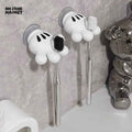 Cartoon hand-shaped suction wall hook displayed on a smooth wall