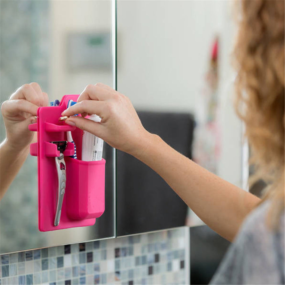 Toothbrushes stored neatly in a multi-functional silicone holder
