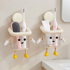 Wall-mounted cartoon toothbrush holder attached to a bathroom wall