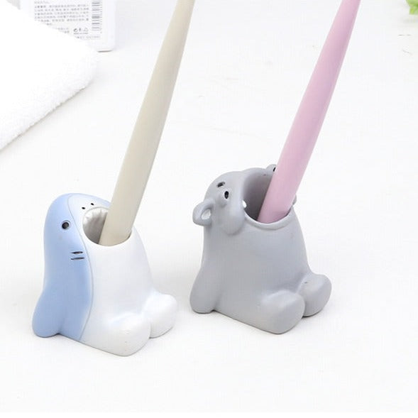 Toothbrush holder and pen pot shown as a practical home organiser