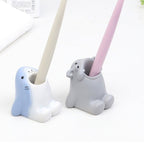Toothbrush holder and pen pot shown as a practical home organiser