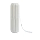 Compact toothbrush storage case displayed from the side